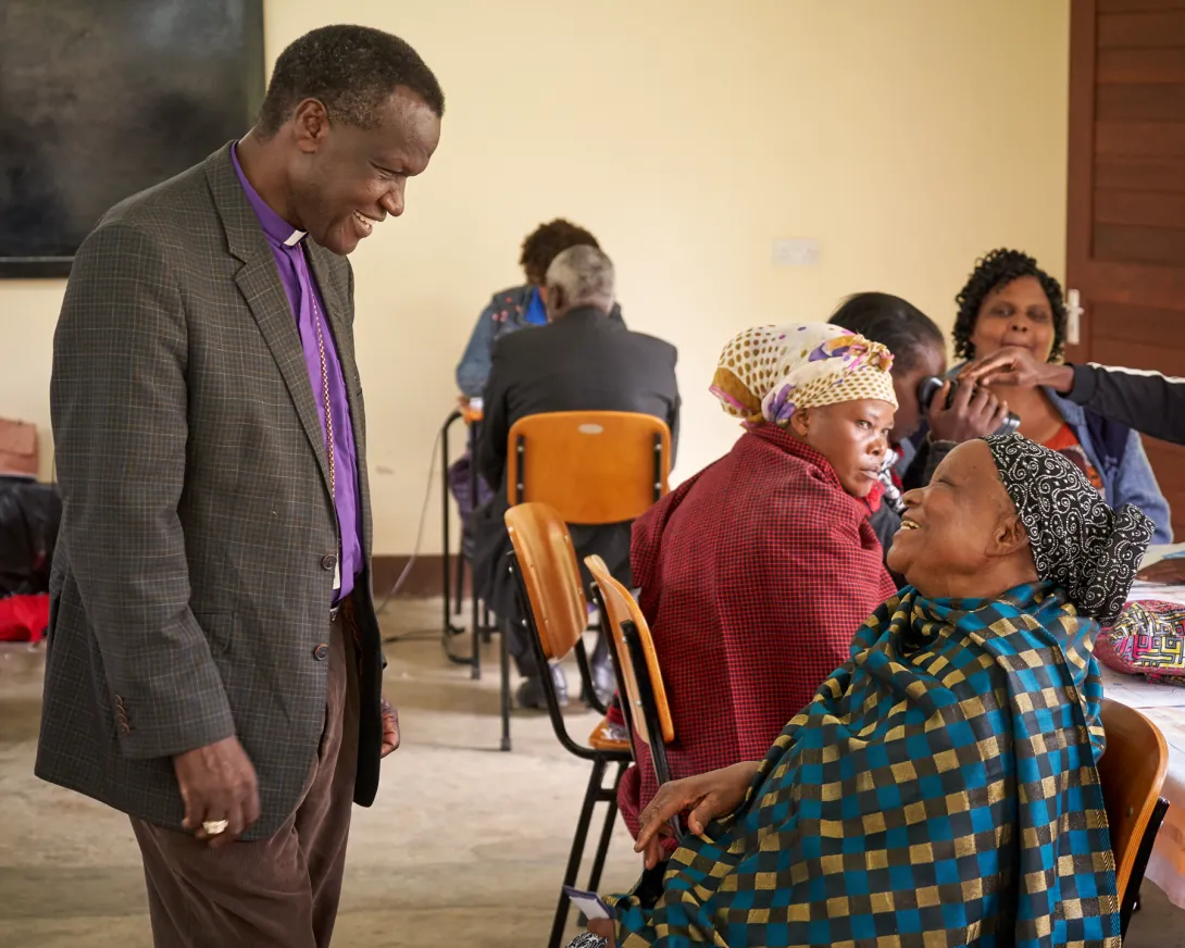 Bishop Kitoi Talking With Tanzanian Woman