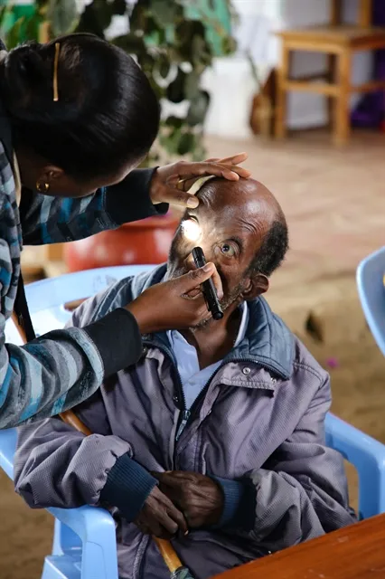 Tanzanian man receives eye exam